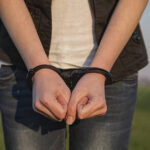 pngtree-handcuffed-woman-s-hands-people-liberty-handcuffs-photo-image_12996726